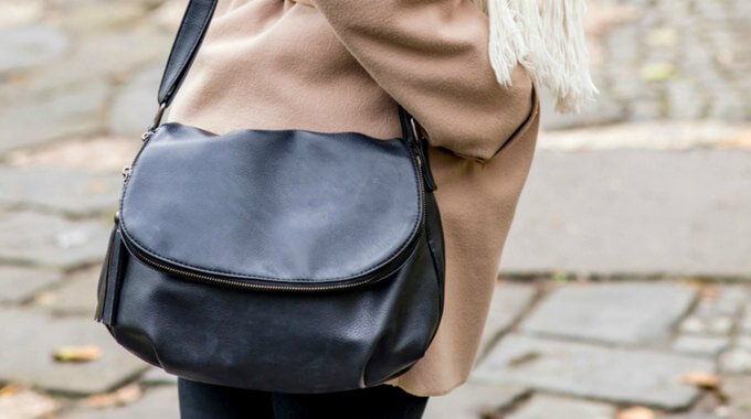woman with black bag - how the 16 Style Types based on Myers Briggs psychological type were conceived